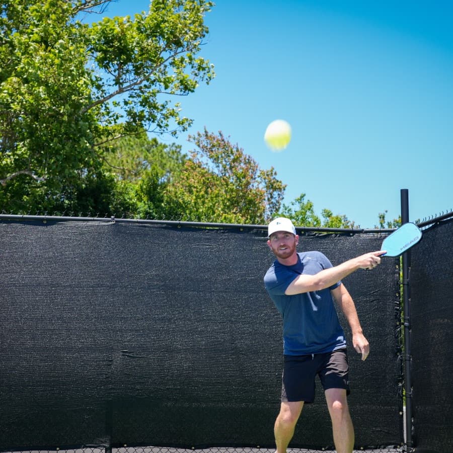 A player driving the ball at Golf Pub Social