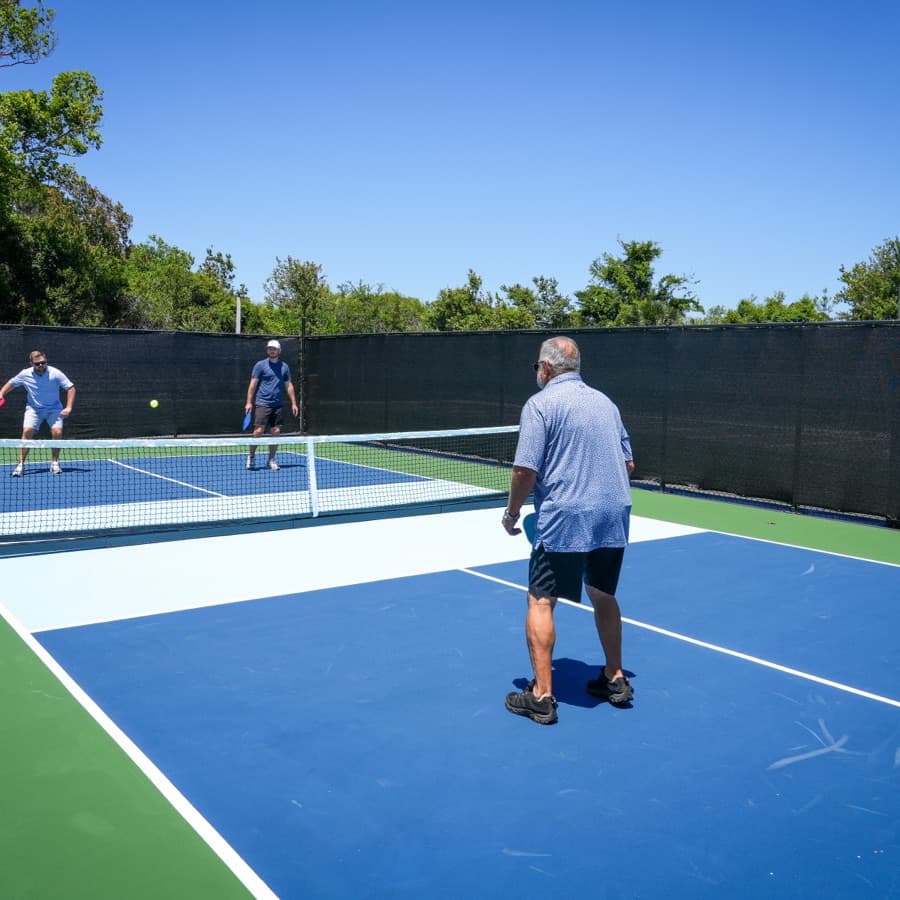 A doubles game on the courts at Golf Pub Social